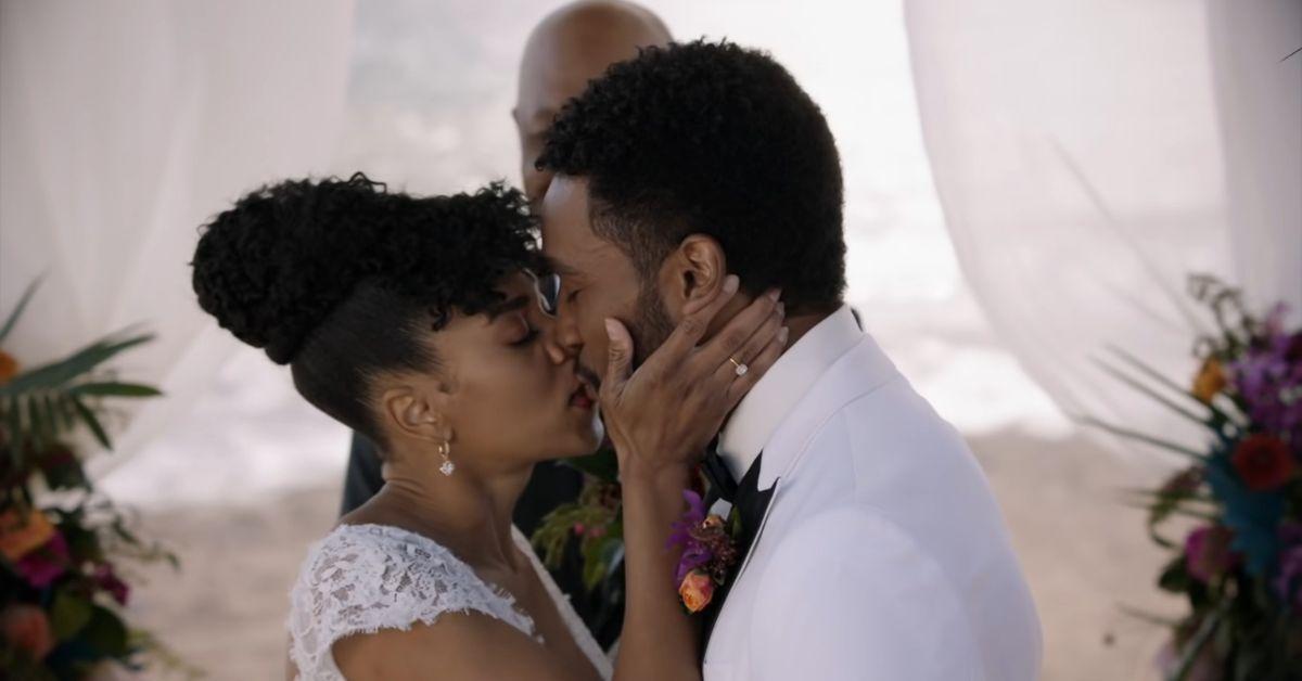 (l-r): Kelly McCreary as Maggie and Anthony Hill as Winston kissing on their wedding day in Season 17 of 'Grey's Anatomy'