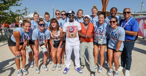 (l-r): Members of the U.S. Women's Water Polo team. Flavor Flav, and Spike Lee.