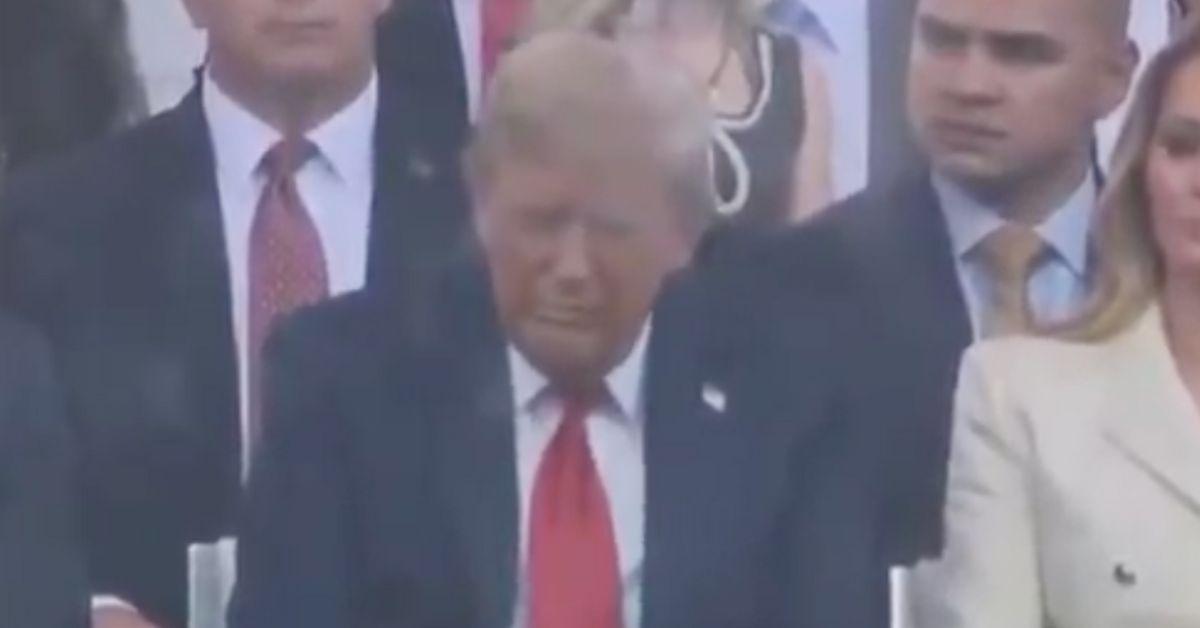 Trump with his eyes closed at the military parade. 