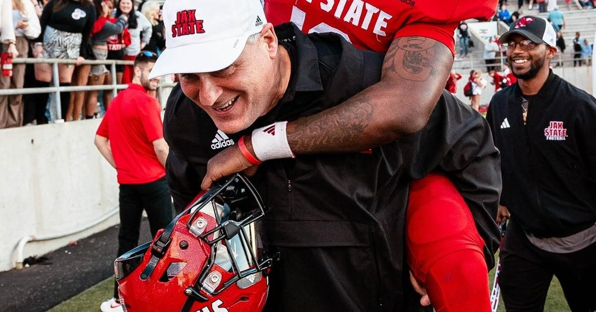 Rich Rodriguez celebrating a win with his team