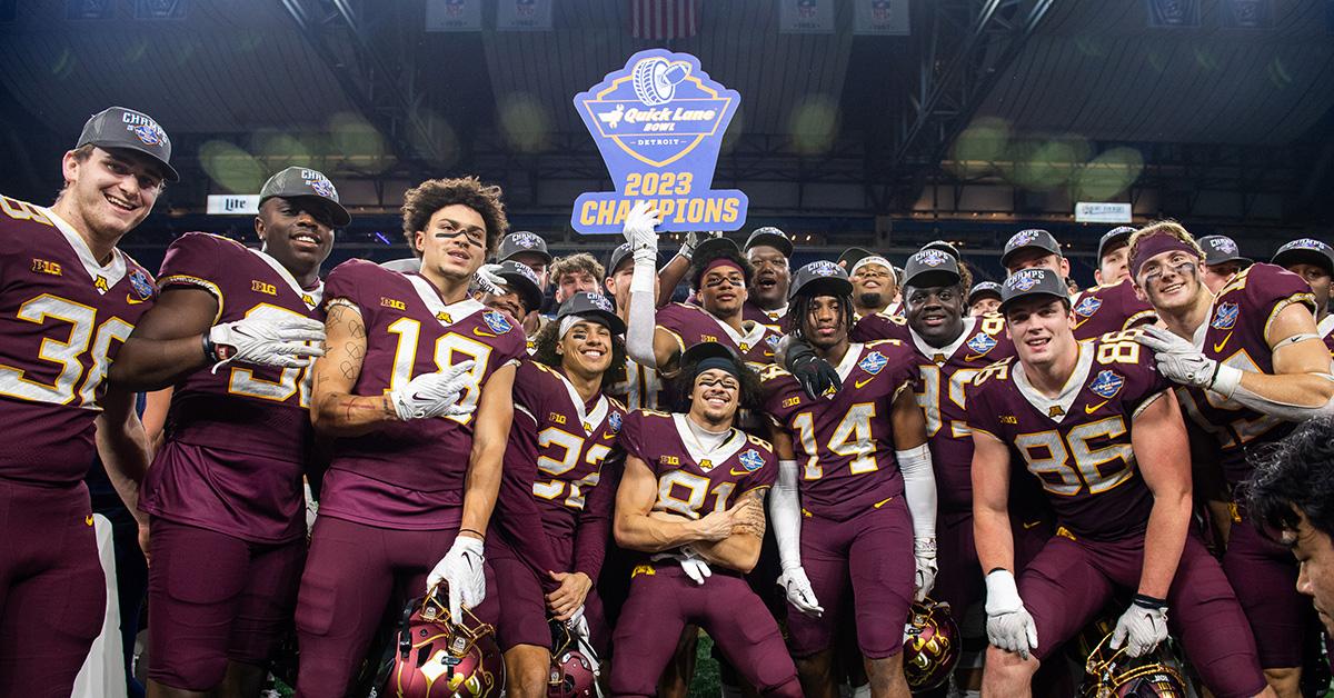 The Minnesota football team posing after winning the Quick Lane Bowl in 2023