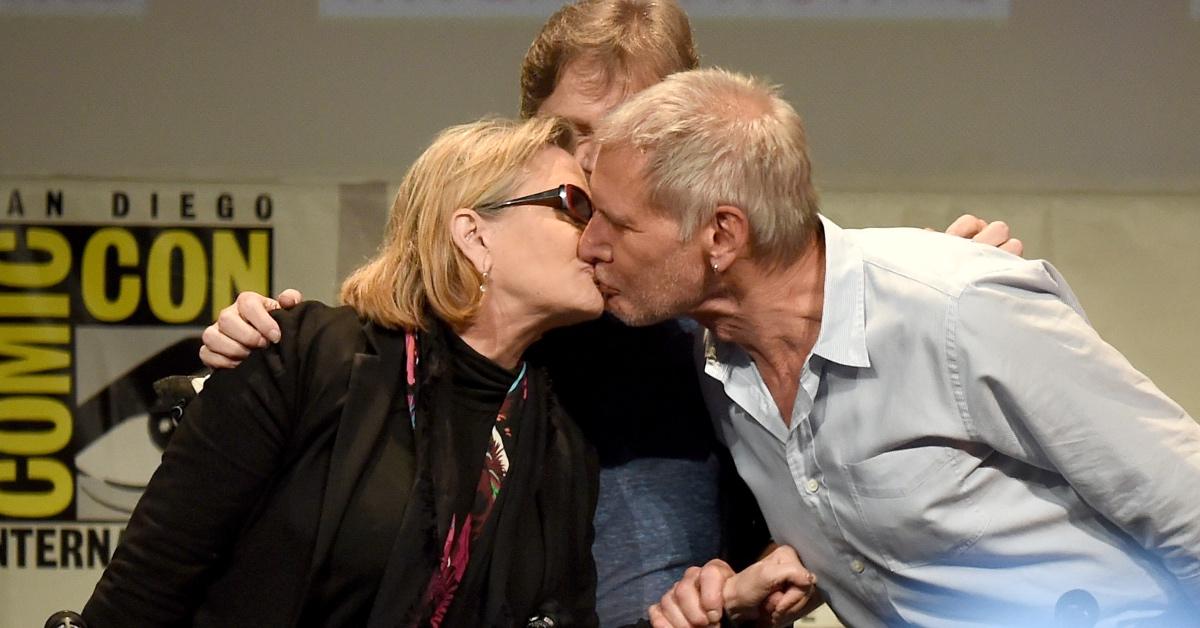 Mark Hamill encourages a kiss between Carrie Fisher and Harrison Ford at San Diego Comic-Con.