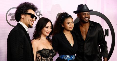 Jason Fordham, Mandie Taketa, Maīle Masako Brady, and Wayne Brady pose on the red carpet of the the 2022 American Music Awards