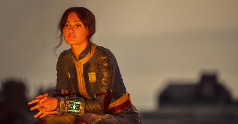 Lucy sitting on the surface in 'Fallout'