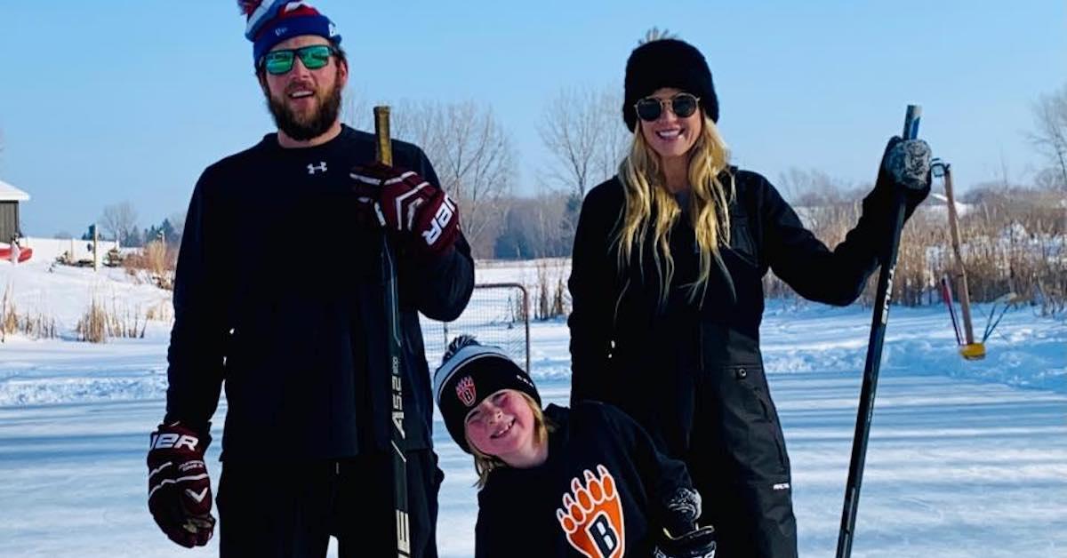 Mike Boche, Luca, and Carolyn Wiger playing hockey