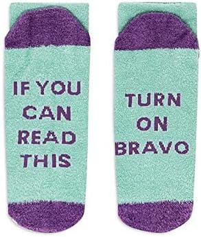 A pair of fuzzy teal and purple socks