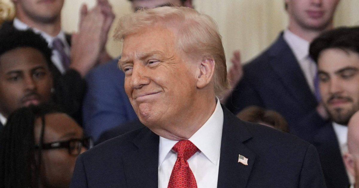 Donald Trump smiling at a public event.