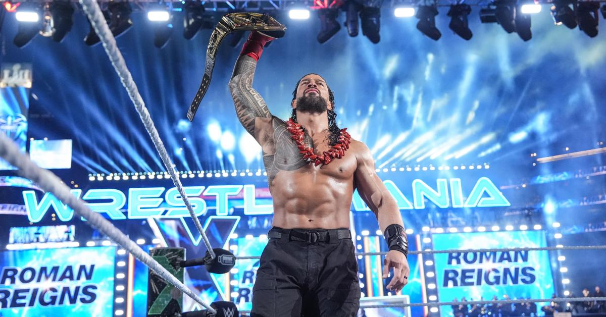 Roman Reigns holds up the Undisputed WWE Universal Championship as he enters the ring during Night Two of 'WrestleMania 40' April 7, 2024 in Philly.