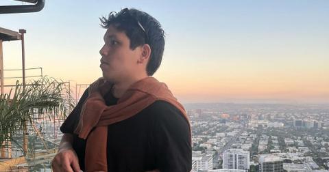 Clinton Kane with an aerial view of a city.