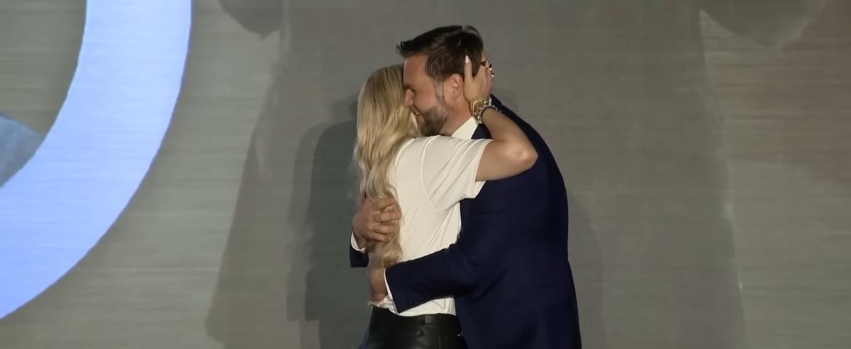 Erika Kirk and JD Vance hugging at a Turning Point USA event.