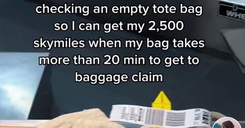 A woman checked on empty bag at an airport for Skymiles