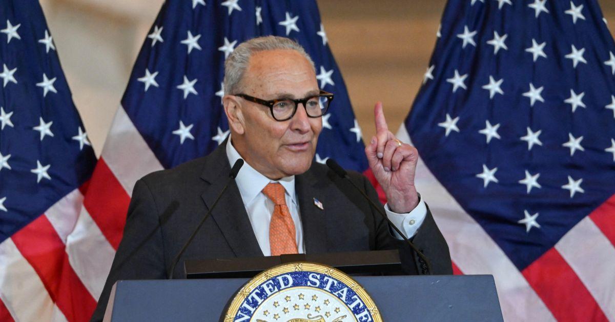 Chuck Schumer speaking at a podium in the Capitol. 
