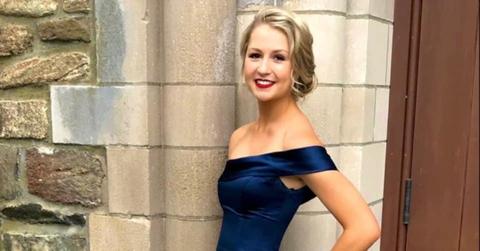 Baylie Grogan in a navy blue dress.