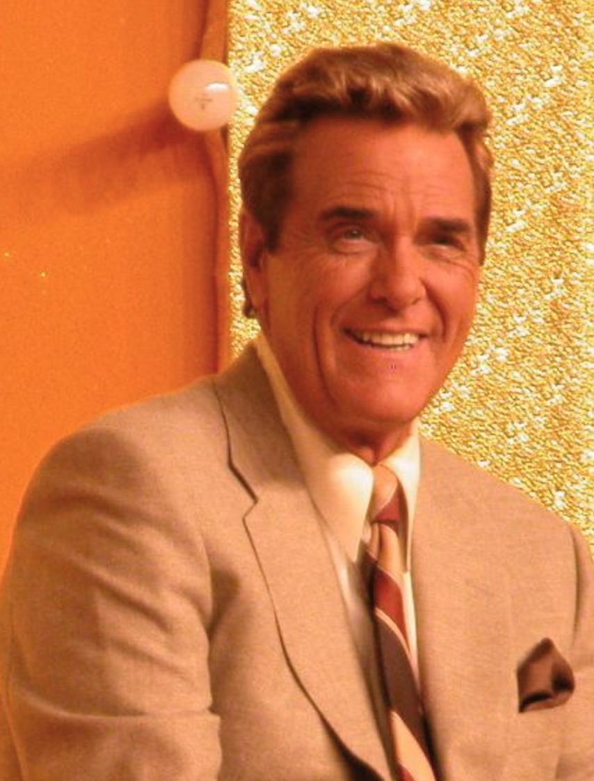 Chuck Woolery smiling.