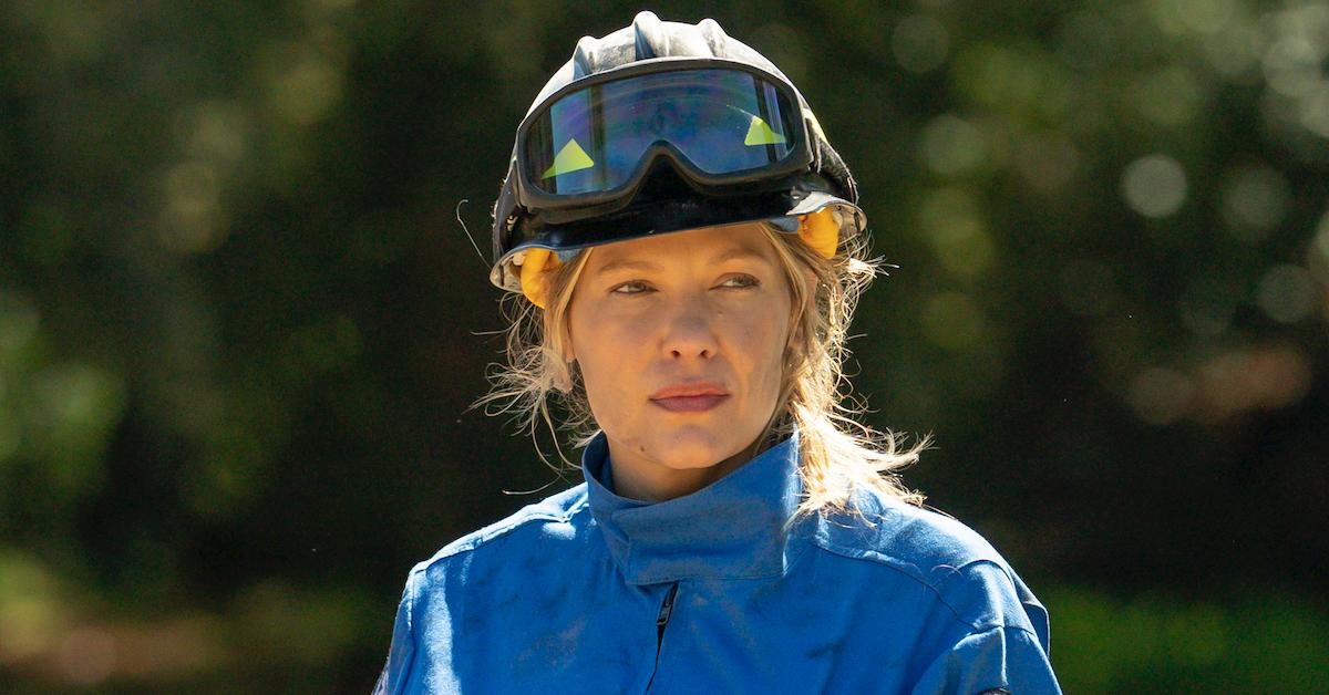 Kiele Sanchez as Kate on 'Station 19' wearing gear in the woods