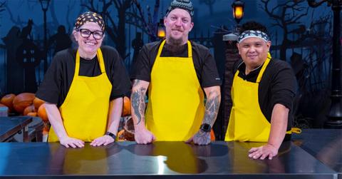 Team Snax Sabbath in yellow aprons behind a counter.