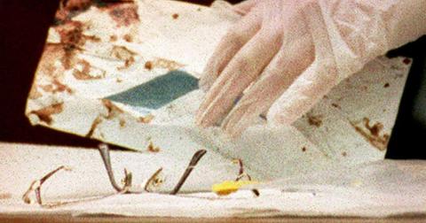 Los Angeles Police criminalist Andrea Mazzola removes the eyeglasses of Juditha Brown from a bloody envelope during the O.J. Simpson murder trial