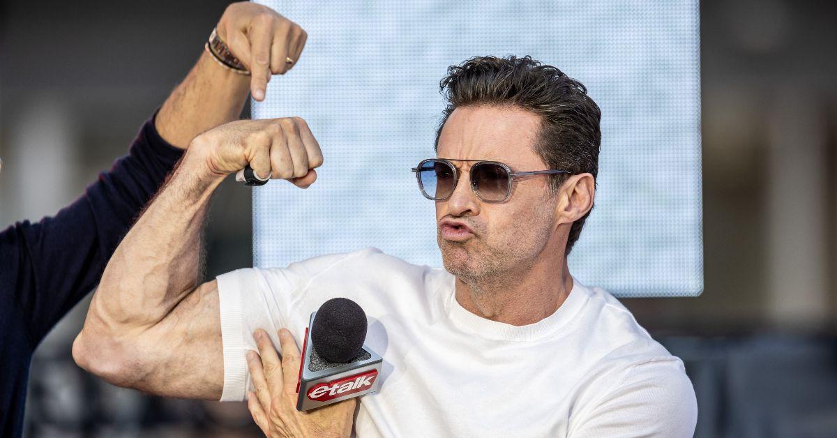 Hugh Jackman flexing