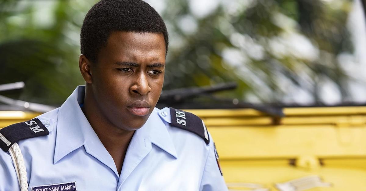 Marlon Pryce (Tahj Miles) in 'Death in Paradise' in cop uniform