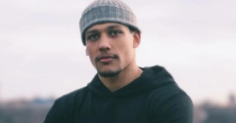 Josh Popper from 'Summer House' wearing a black hoodie and gray beanie