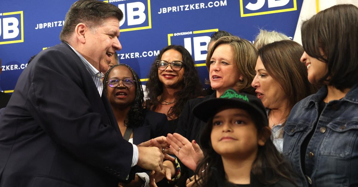 Illinois Governor JB Pritzker greets supporters with Texas Dems. 