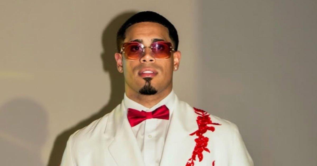 Michael Flores wearing a white tux.