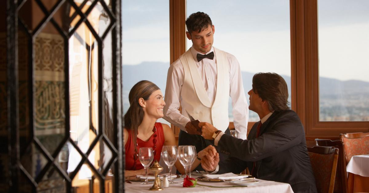 Couple enjoying a meal at a restaurant.