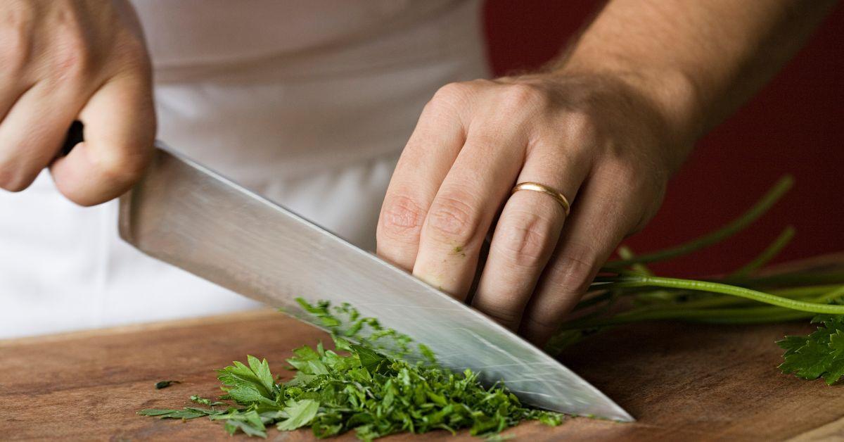 man chopping vegetables