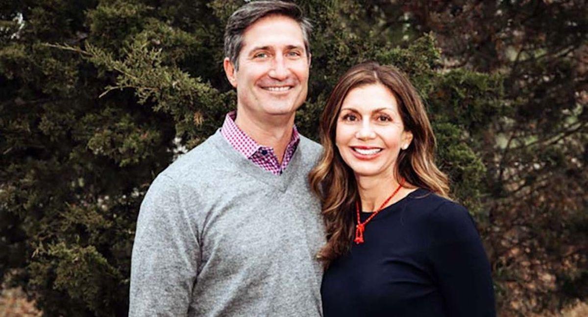 Brian and Jennifer Niccol smiling in front of trees