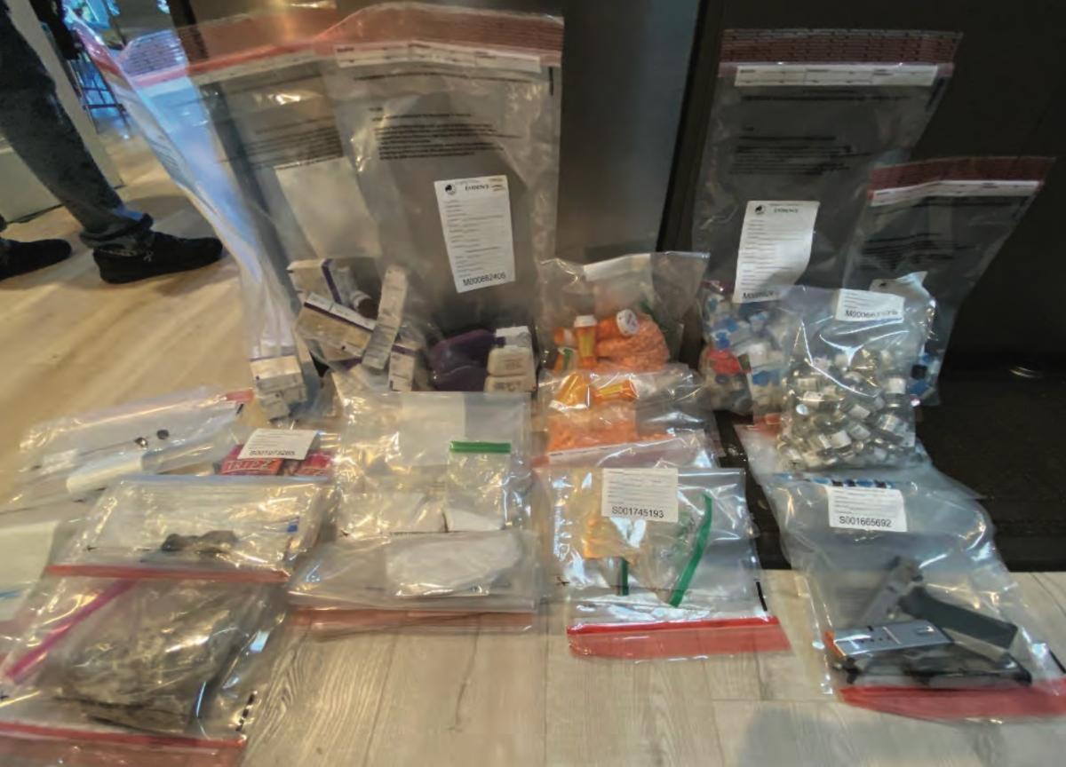 Drug paraphernalia and weapons seized from Sangha's residence