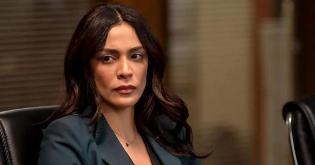 ADA Sam Maroun in a dark green suit on 'Law & Order'