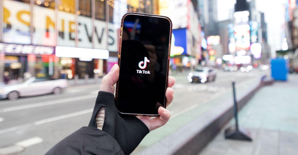 A TikTok logo on a phone in New York City. 