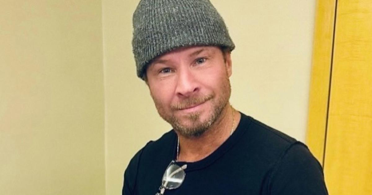 Brian Littrell signing a pair of shoes.