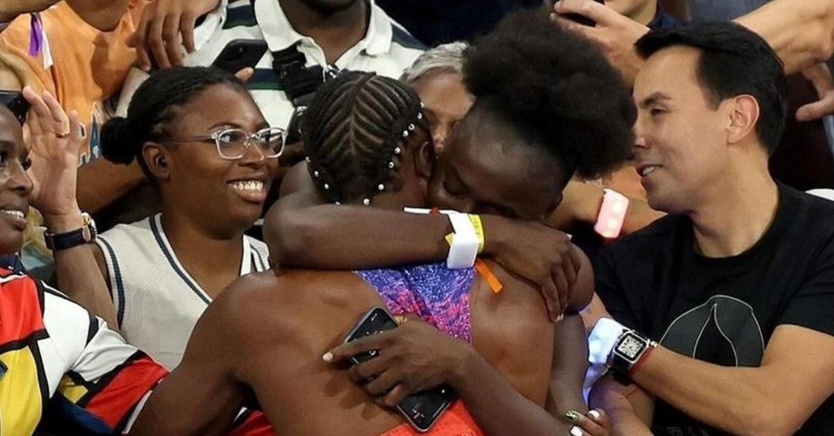 (l-r): Noah Lyles and Junelle Bromfield hugging while celeberating his Olympic gold medal