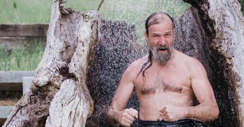 Wim Hof in an outdoor shower.