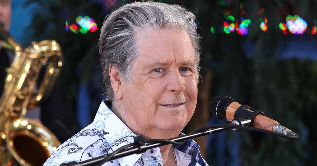 Brian Wilson singing on stage.