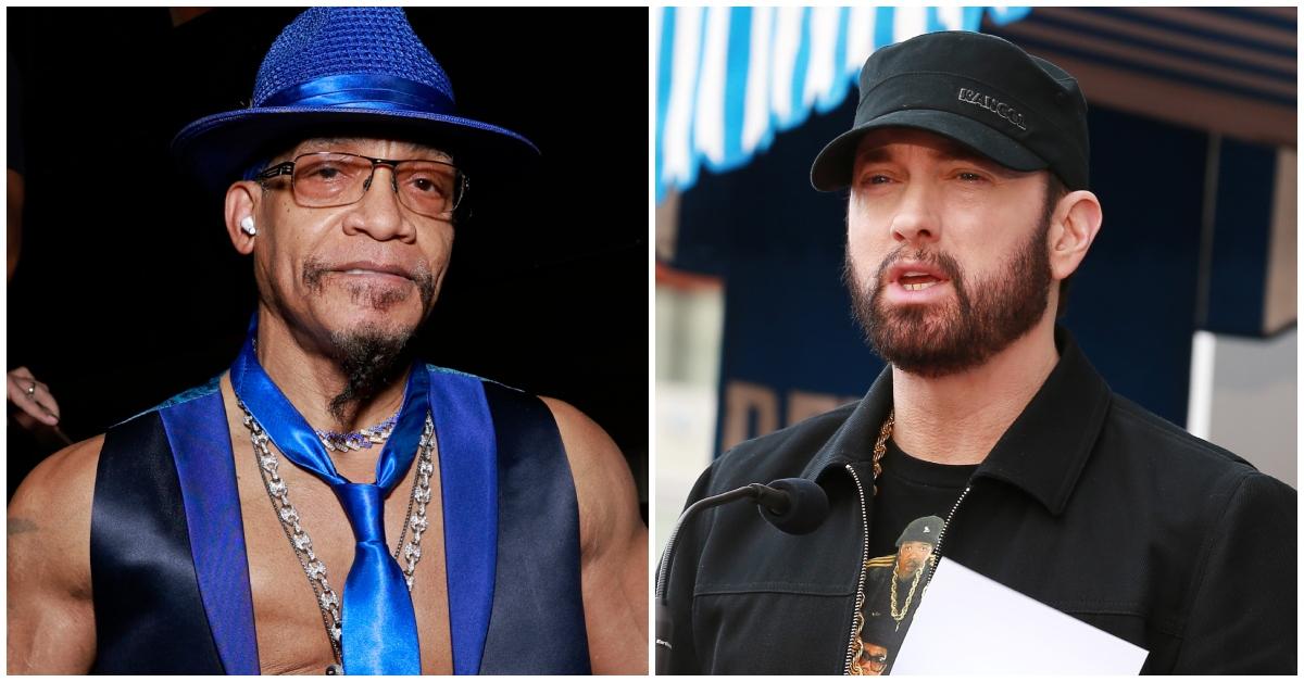 Melle Mel wears blue hat and matching neck-tie, chains and vest, Eminem speaks wearing a hat and jacket.