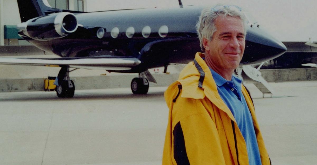 Jeffrey Epstein stands near his private plane