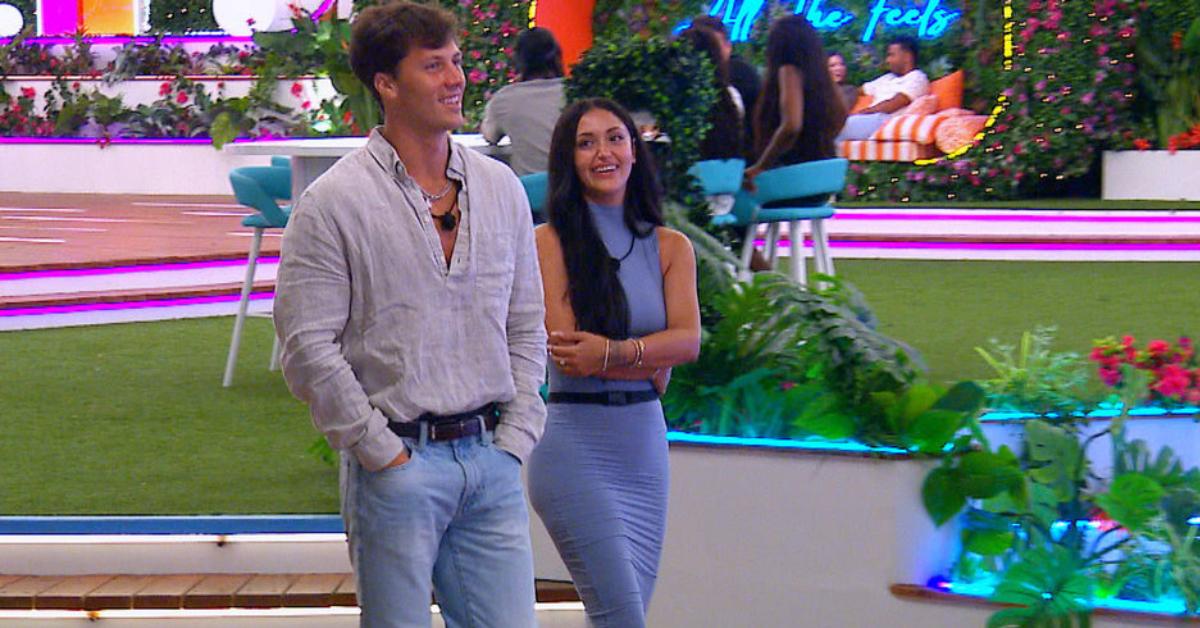 Rob and Leah smile while walking and chatting in Season 6 of 'Love Island USA.'