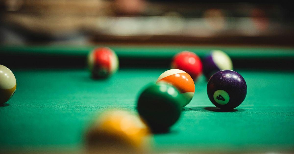 A Green Pool Table During a Game