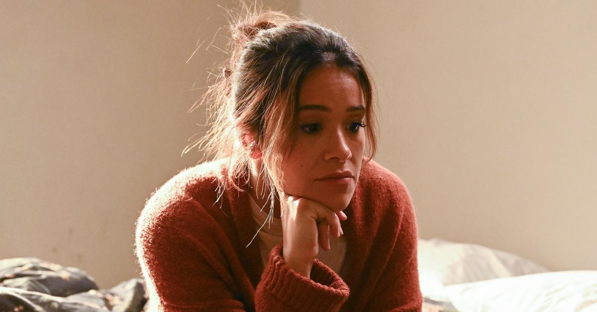 Gina Rodriguez as Nell looking defeated on 'Not Dead Yet".