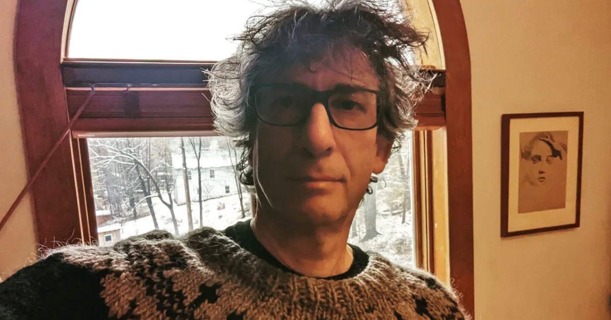 Neil Gaiman in 2022 wearing a sweater.