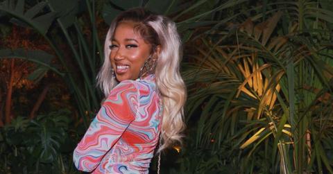 Yung Baby Tate taking a photo while out on the town.