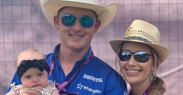 Spencer Wright, Kallie Wright, and their child