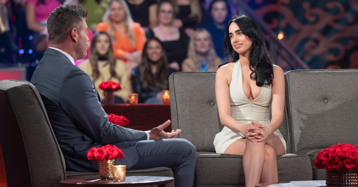 Maria Georgas stuns in a cream-colored halter top minidress as she sits in the hot seat during the "Women Tell All" episode.