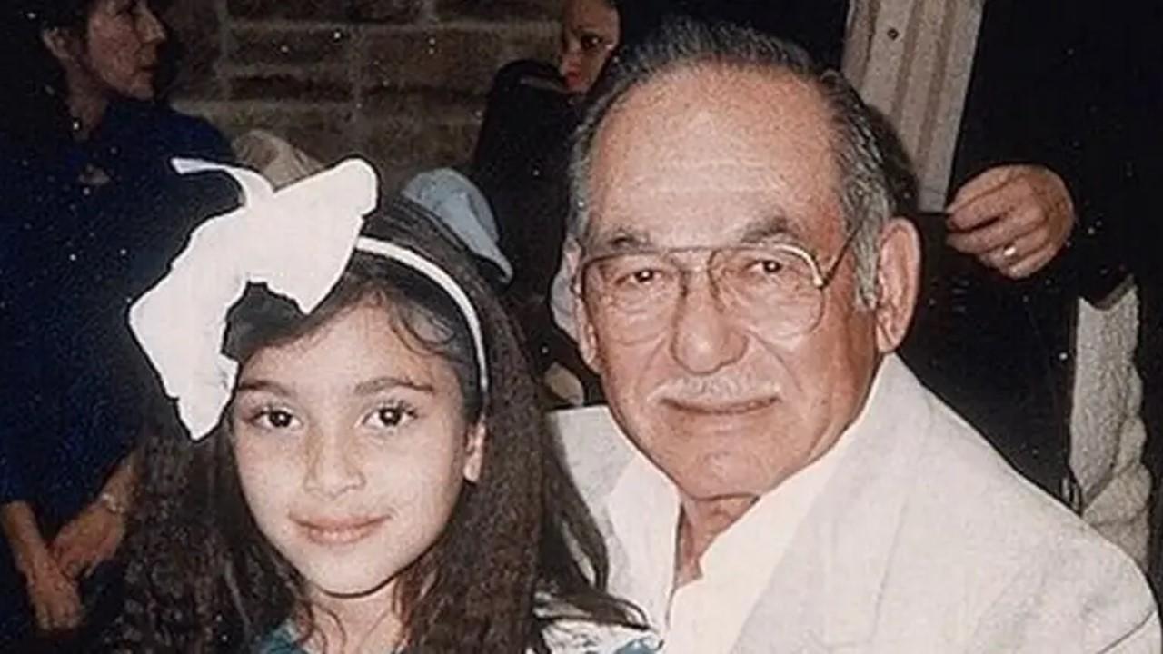 Kim Kardashian sitting with her grandfather, Arthur Kardashian