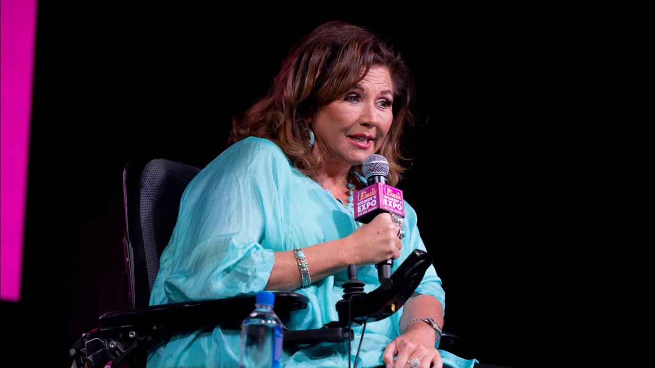 Abby Lee Miller speaking at the 2022 Ultimate Women's Expo Houston Day 2 on Dec. 4, 2022