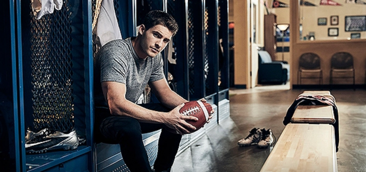 Asher Adams in the football locker room on 'All American'.