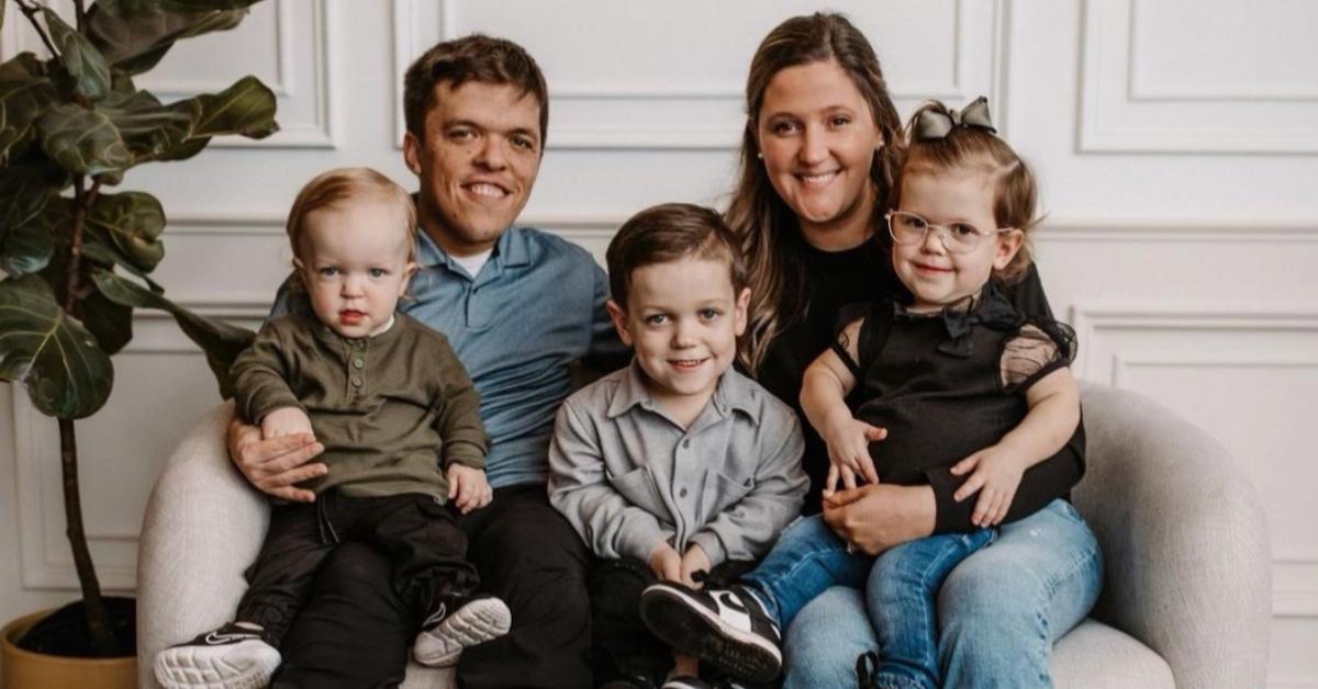 Zach Roloff, his wife Tori, and their three kids sitting on a couch.