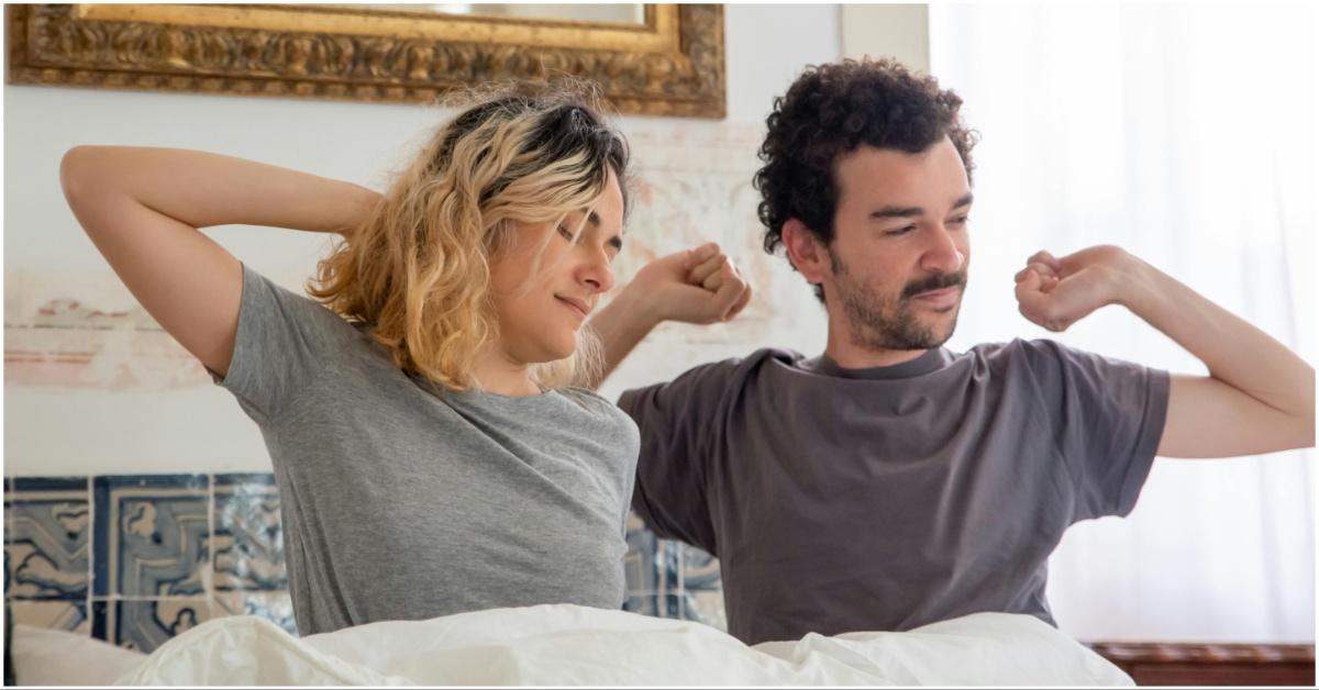 A couple stretching and waking up